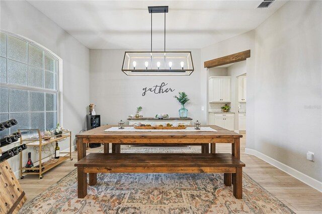 dining space featuring hardwood / wood-style floors