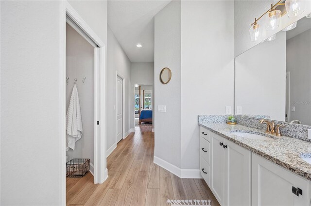 bathroom featuring vanity and hardwood / wood-style flooring