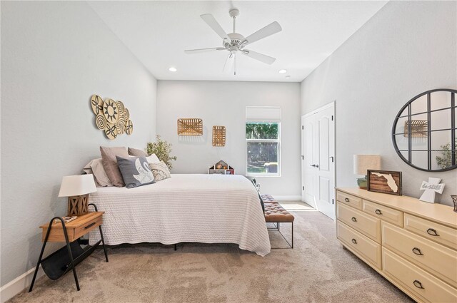 carpeted bedroom with ceiling fan