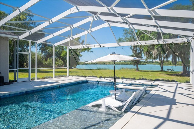 view of pool with a yard, a lanai, and a patio area