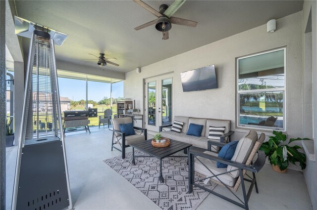 interior space with ceiling fan and french doors