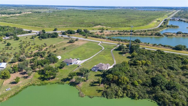 birds eye view of property with a water view and a rural view