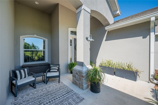 doorway to property featuring a patio