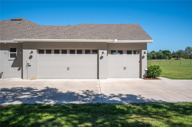 garage featuring a yard