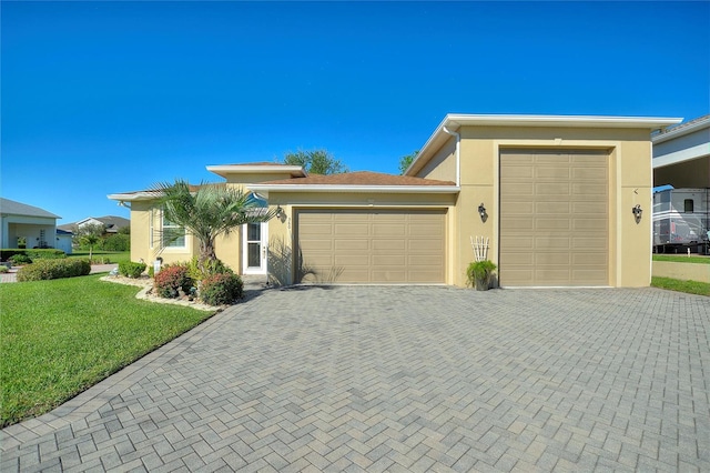 view of front of property featuring a garage and a front yard