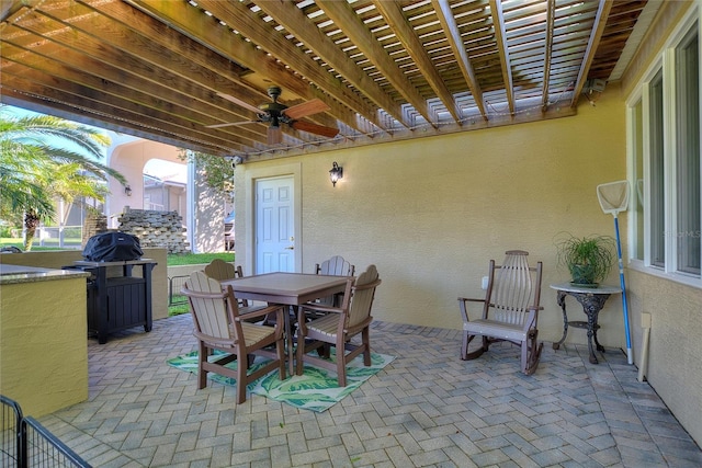 view of terrace featuring a pergola and ceiling fan