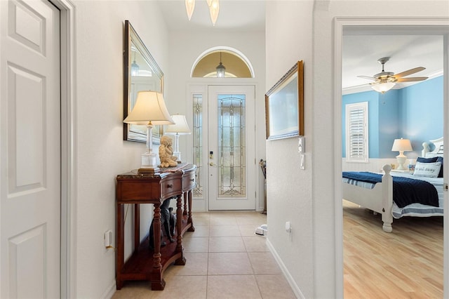 entrance foyer featuring ceiling fan and light tile flooring