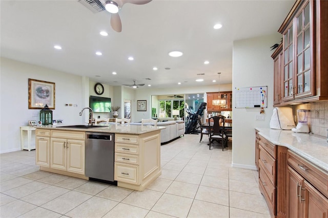 kitchen featuring cream cabinetry, sink, ceiling fan, and stainless steel dishwasher