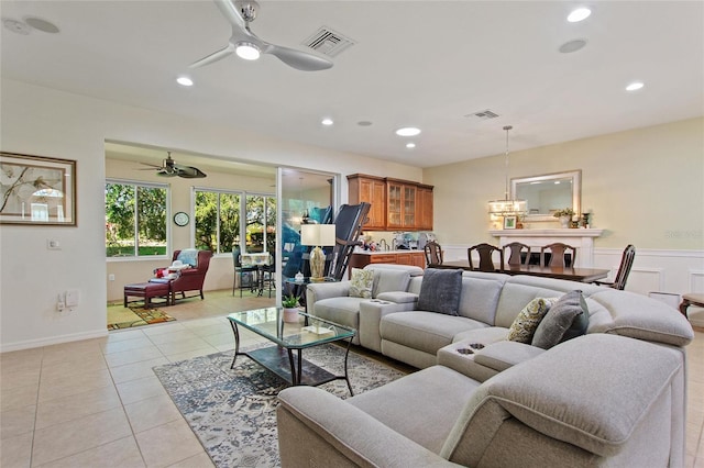 tiled living room featuring ceiling fan