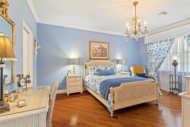 bedroom with a chandelier, ornamental molding, and dark hardwood / wood-style flooring