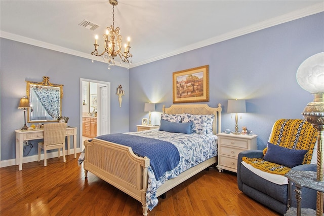 bedroom featuring crown molding, an inviting chandelier, connected bathroom, and hardwood / wood-style floors