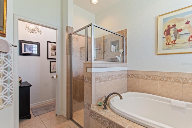 bathroom with tile floors, independent shower and bath, and vanity