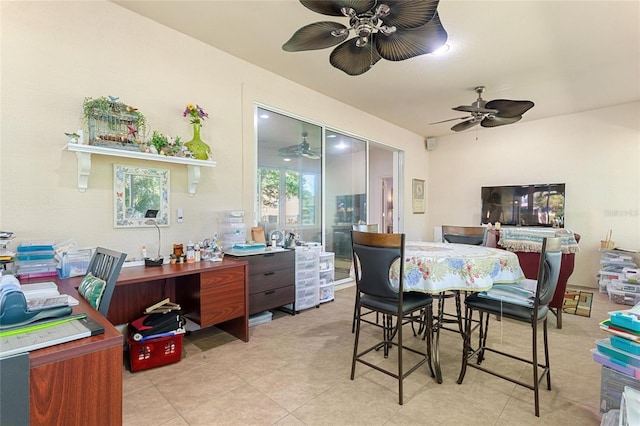 tiled dining area with ceiling fan