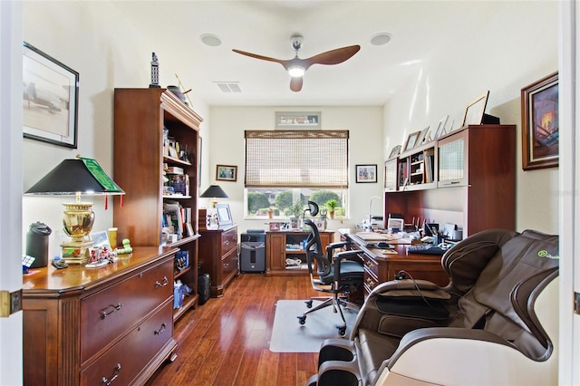 office with ceiling fan and dark wood-type flooring