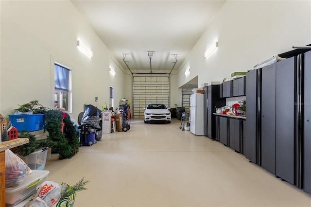 garage featuring white fridge