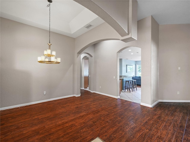 interior space featuring a chandelier and hardwood / wood-style floors