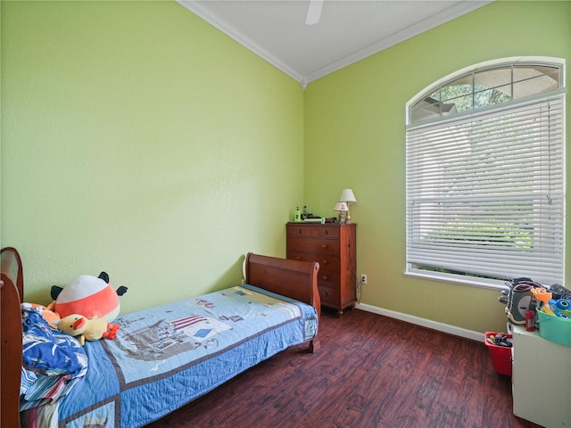 bedroom with ceiling fan, crown molding, and dark wood-type flooring