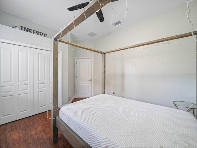 bedroom featuring a closet, ceiling fan, and dark hardwood / wood-style flooring