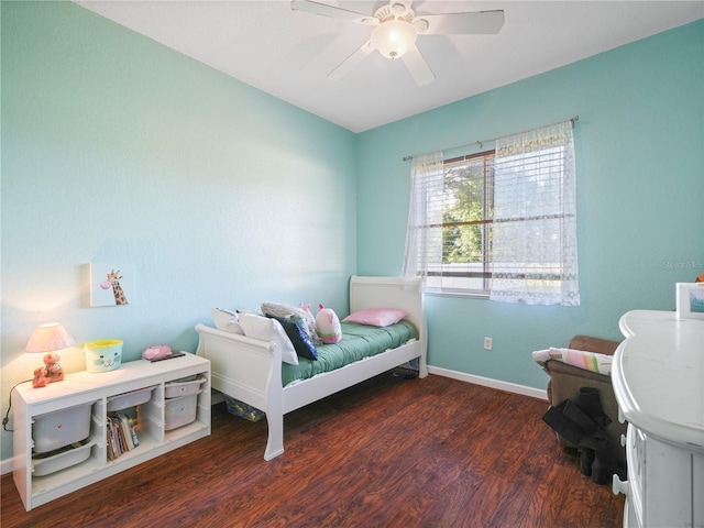 bedroom with ceiling fan and dark hardwood / wood-style floors