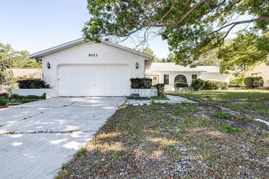 ranch-style home with a garage