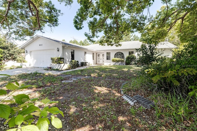 single story home featuring a garage