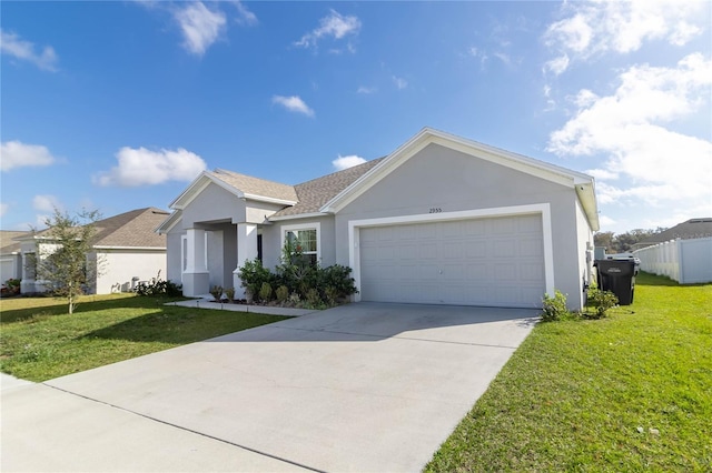 single story home with a garage and a front lawn