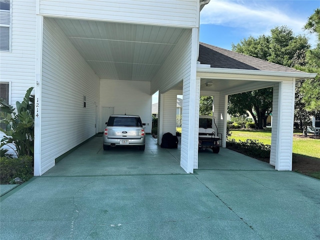 view of vehicle parking featuring a carport