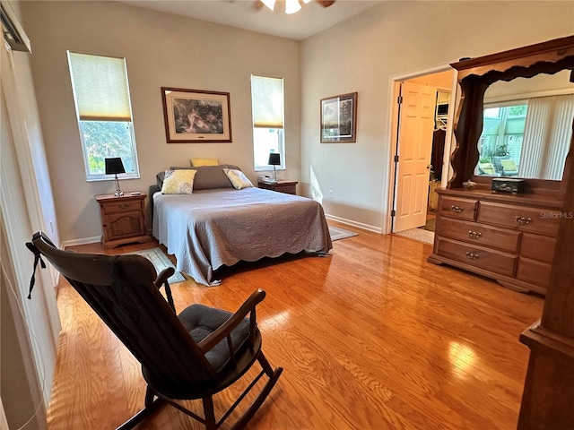 bedroom with light hardwood / wood-style flooring and ceiling fan