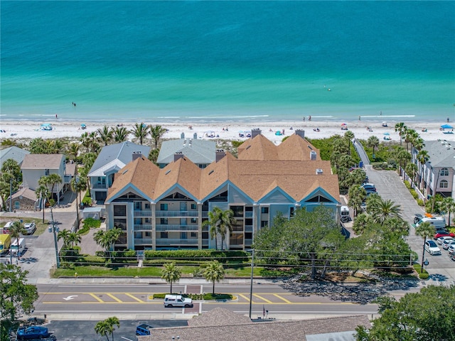 bird's eye view with a water view and a view of the beach