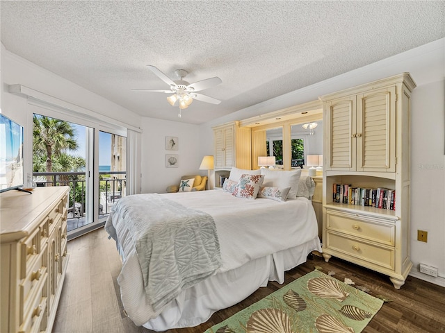 bedroom featuring a textured ceiling, ceiling fan, hardwood / wood-style floors, and access to exterior