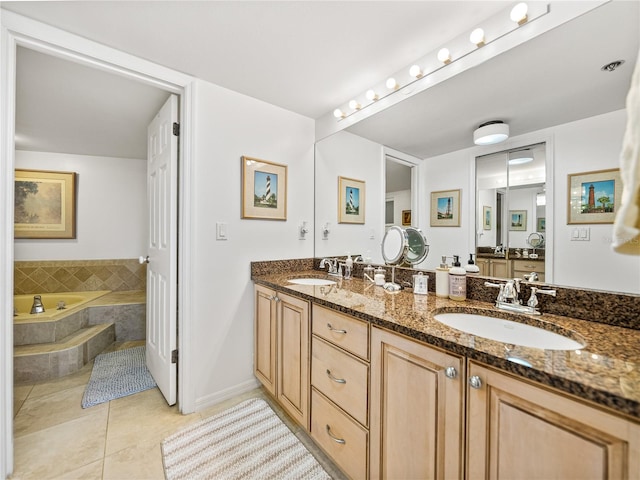 bathroom with tile floors, tiled tub, double sink, and large vanity