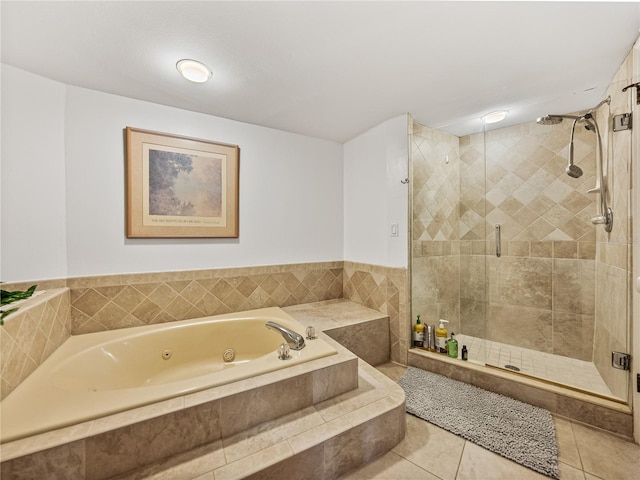 bathroom featuring independent shower and bath and tile floors