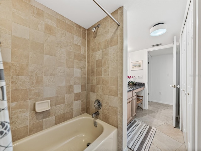 bathroom featuring shower / bath combo with shower curtain, tile floors, and vanity