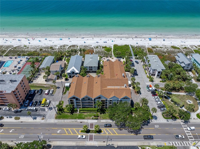 bird's eye view with a view of the beach and a water view