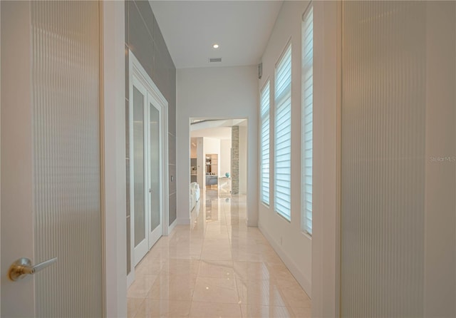 hallway featuring light tile floors