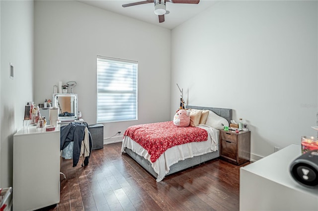 bedroom with ceiling fan and dark hardwood / wood-style flooring