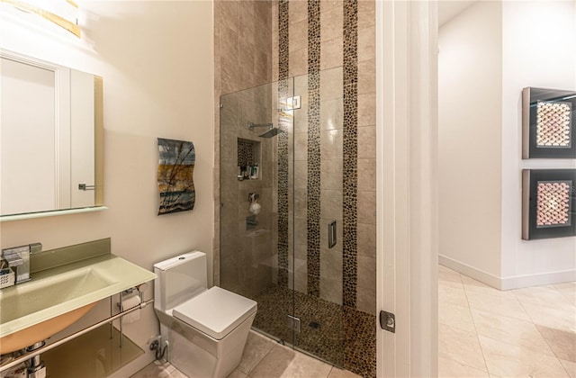 bathroom with a shower with shower door, vanity, and tile flooring