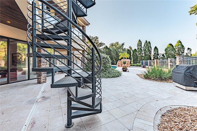 view of patio with a grill