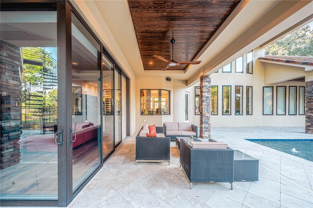 view of patio / terrace with an outdoor living space and ceiling fan