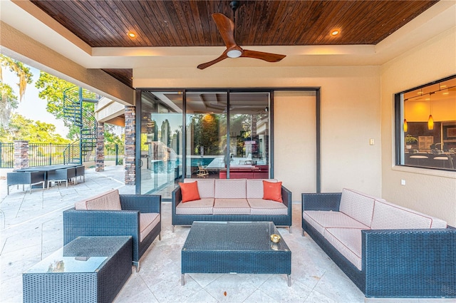 view of patio featuring an outdoor living space and ceiling fan