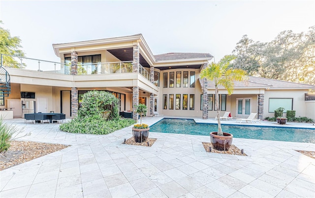 view of swimming pool with a patio