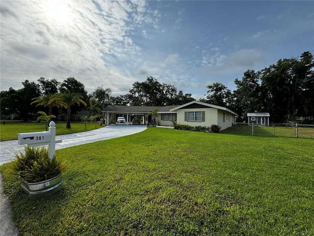 ranch-style home with a front lawn