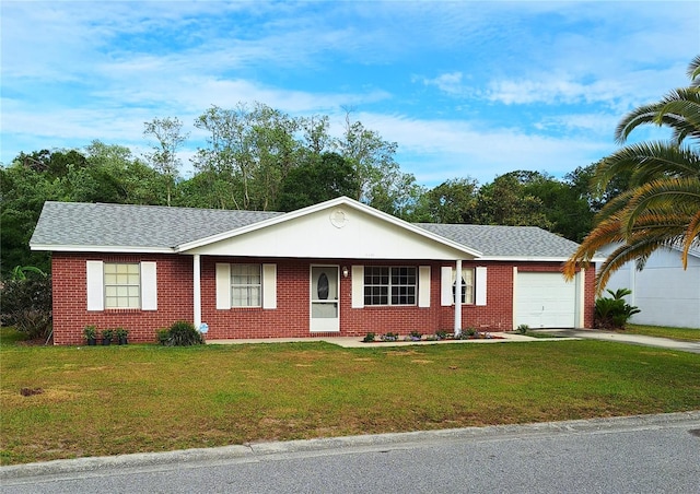 single story home with a garage and a front lawn