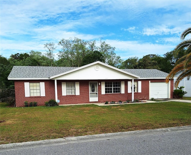 single story home featuring a garage and a front yard