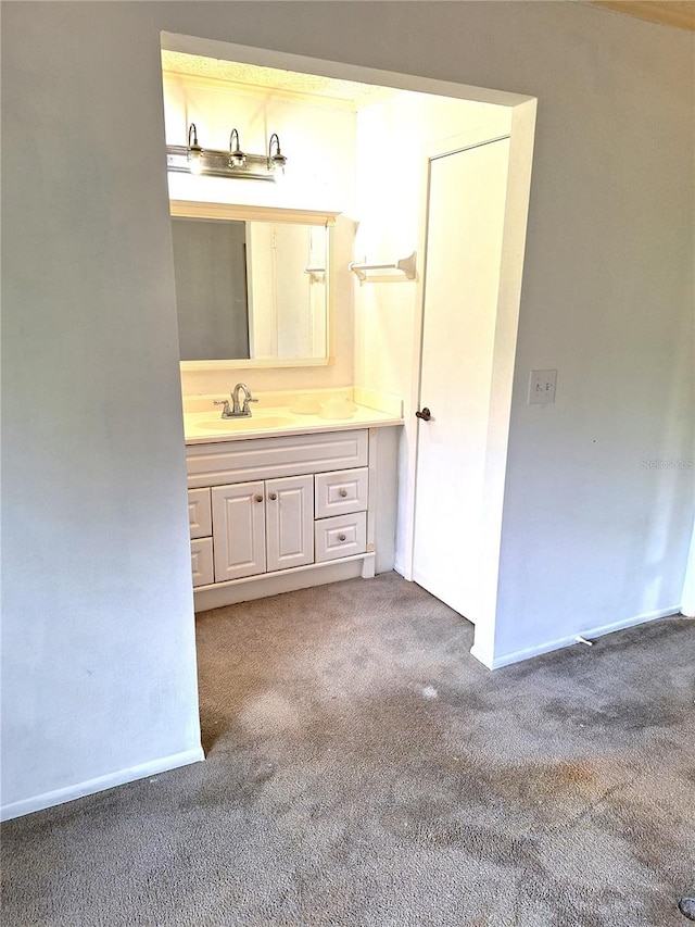 bathroom with vanity with extensive cabinet space