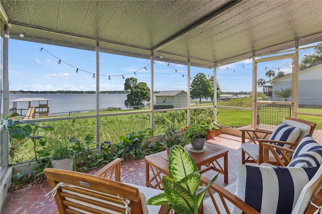 sunroom with a water view