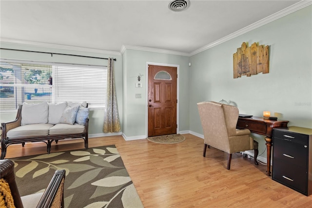 office space featuring light hardwood / wood-style floors and crown molding