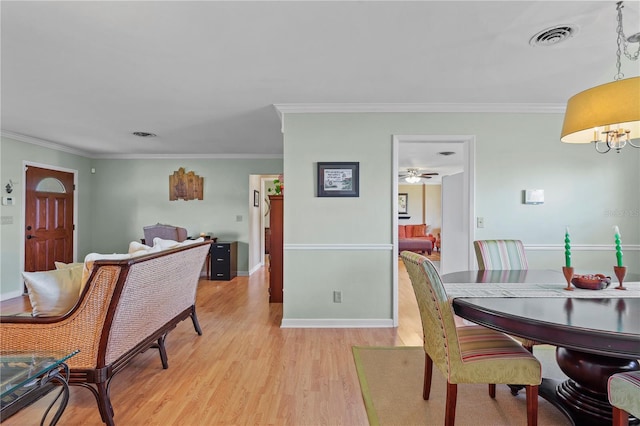 dining room featuring ornamental molding, ceiling fan, and hardwood / wood-style flooring