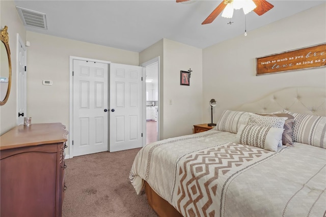 carpeted bedroom featuring ceiling fan