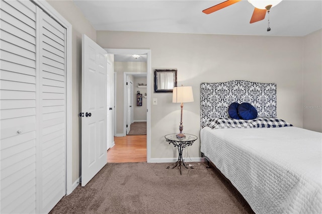 bedroom with a closet, ceiling fan, and carpet